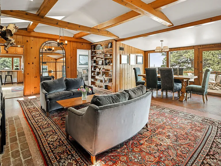 Kitchen to left of mirror, TV room on right