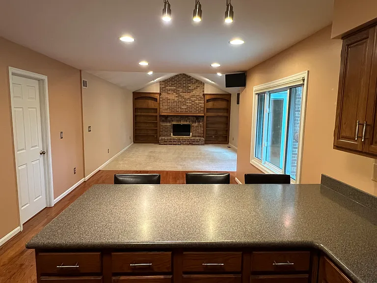 Kitchen peninsula to family room view