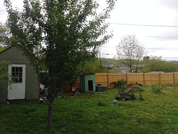 Spacious fenced backyard smallshed