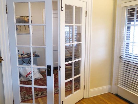 Office located off living room behind french doors. Covered 