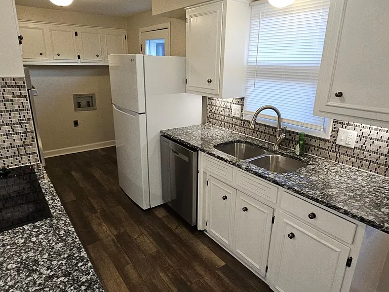 Granite countertops and newer tile.