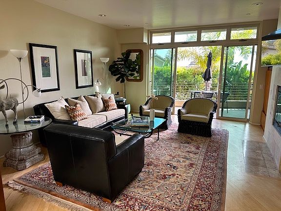 Beautifully furnished living room. Fireplace, Open deck.