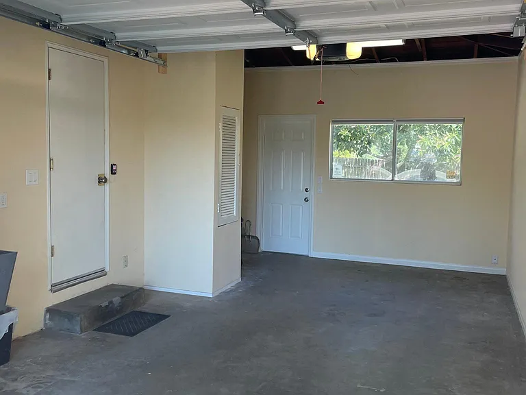 Oversized one car garage with utility sink and washer & dryer hook-up