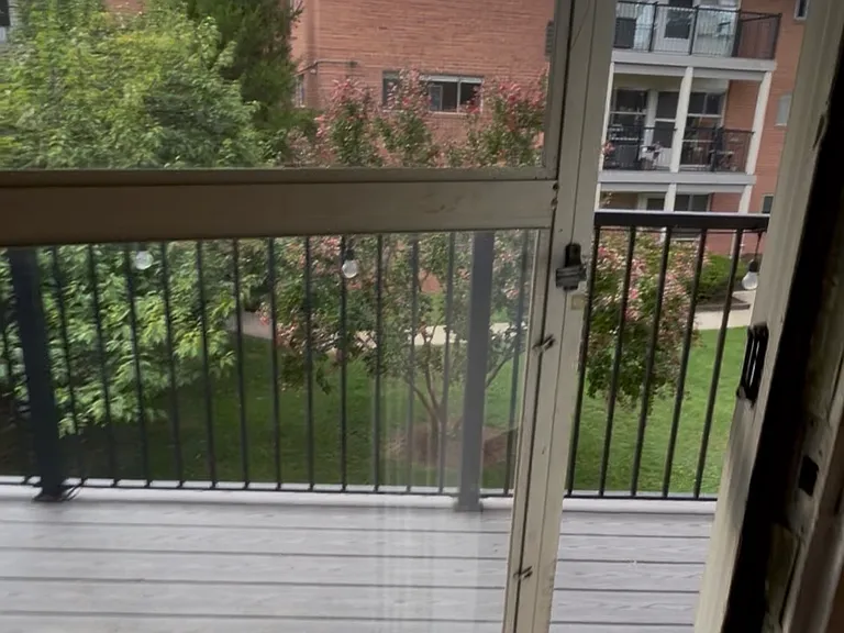large balcony overlooking garden courtyard
