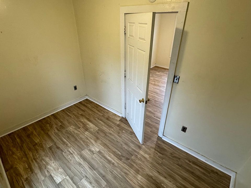 Bedroom 2 w/ new flooring and paint