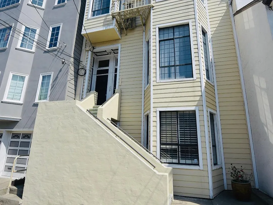 Front of building. Siding is new.