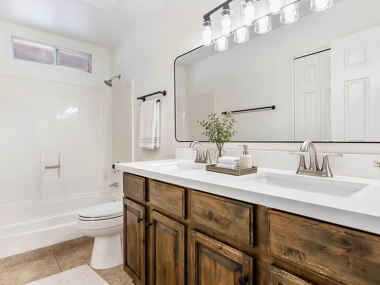 Bathroom 2 with Dual Sinks: virtually staged for inspiration _ home is offered unfurnished