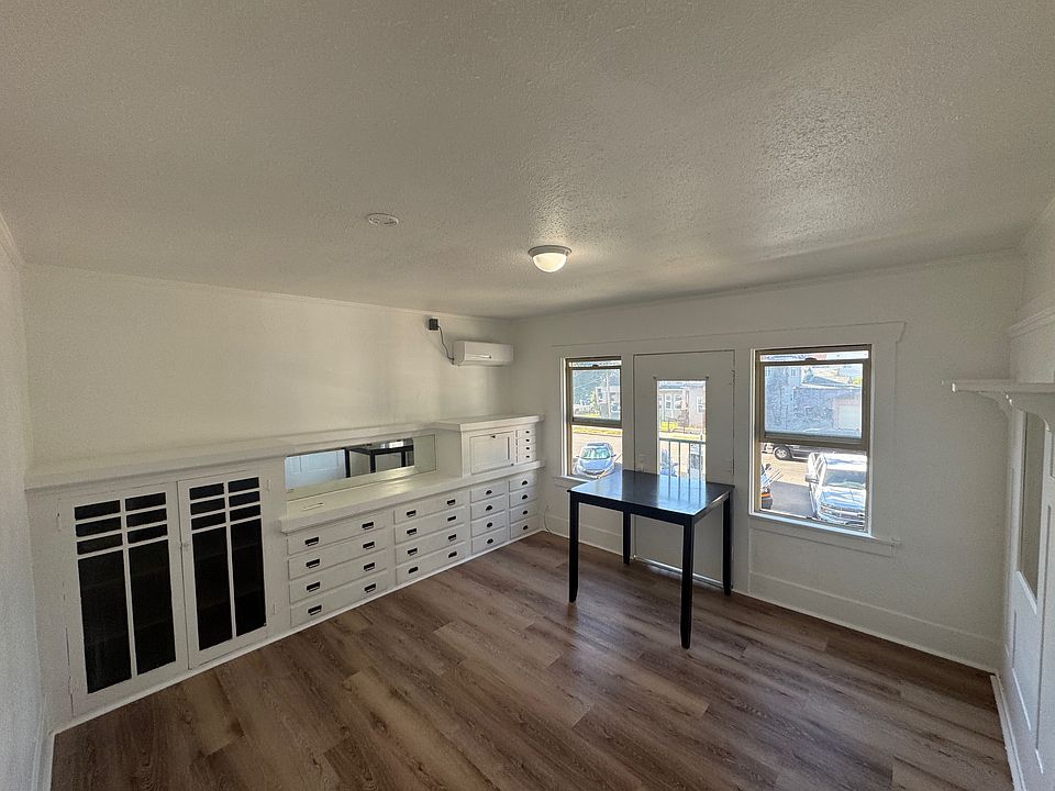 Living room with Murphy bed pulled into wall