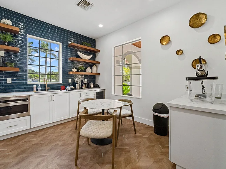 Catering kitchen, cafe-style seating, and complimentary coffee