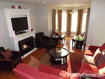 Living Room Main Level
						:
						9' ceilings, hardwood floors, gas log fireplace and 180 degree views