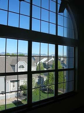 Large living room windows provide lots of natural light.