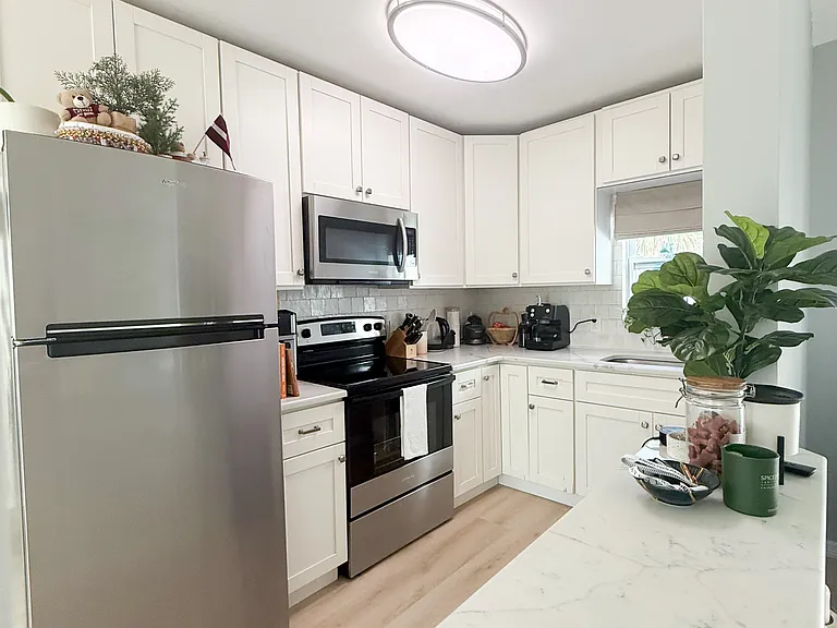 Kitchen with Stainless Steel Appliances and Quartz Countertops