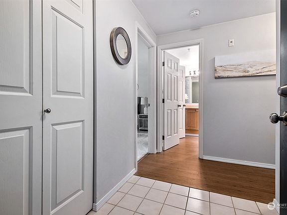 Walking in the door  you can see one of the doors to the continental bathroom, and the laundry is on the left here. >