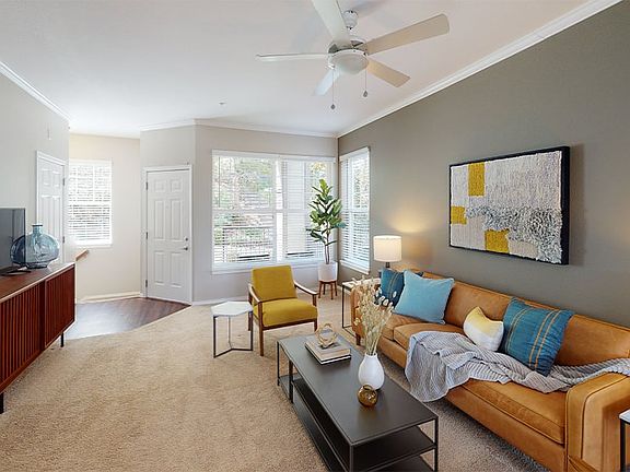 Living rooms include ceiling fans and contemporary paint scheme throughout