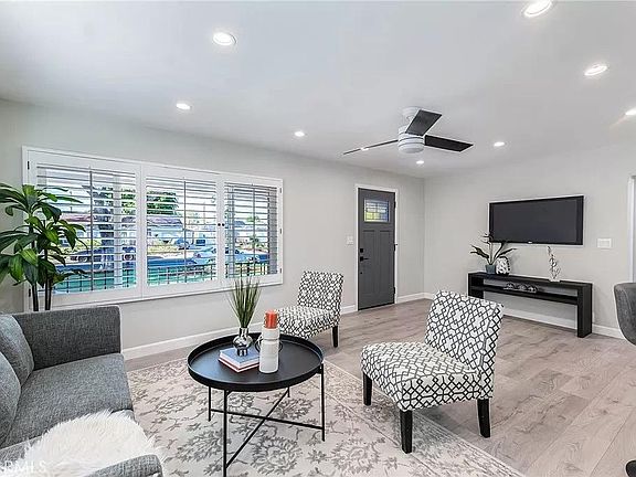 Main Livingroom - Shown with staging to highlight layout and potential.