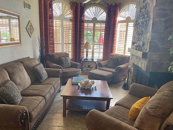 Living room facing pool and lake
