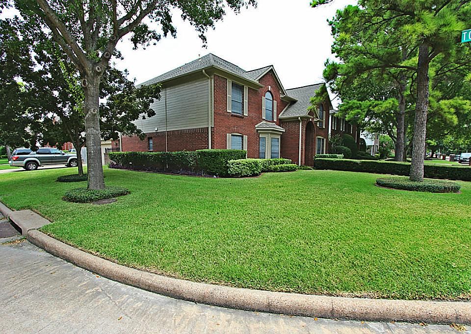 This Enormous corner lot is beautifully landscaped !