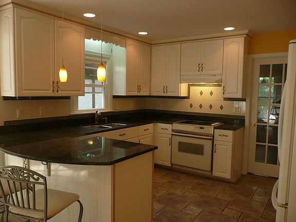 Kitchen with New stainless steel stove and refrigerator(not shown)