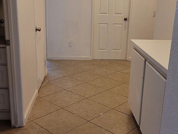 The Hallway has a linen closet and leads to the 2 car garage.