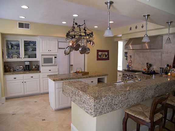 Gourmet kitchen with gorgeous granite and professional DCS range