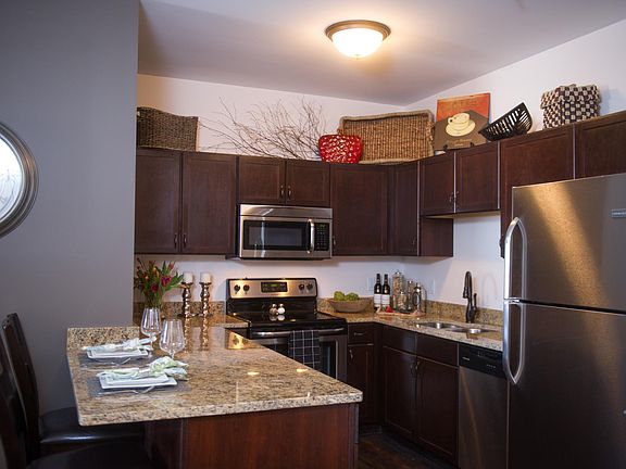 Newer granite countertops throughout, includes garbage disposal, stainless appliances including built-in microwave and dishwasher.