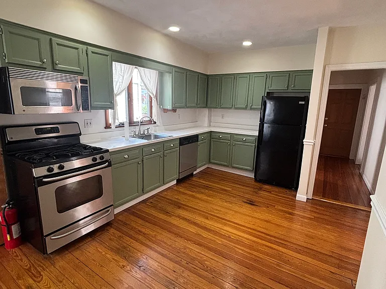 Kitchen (view to hallway and entrance door)