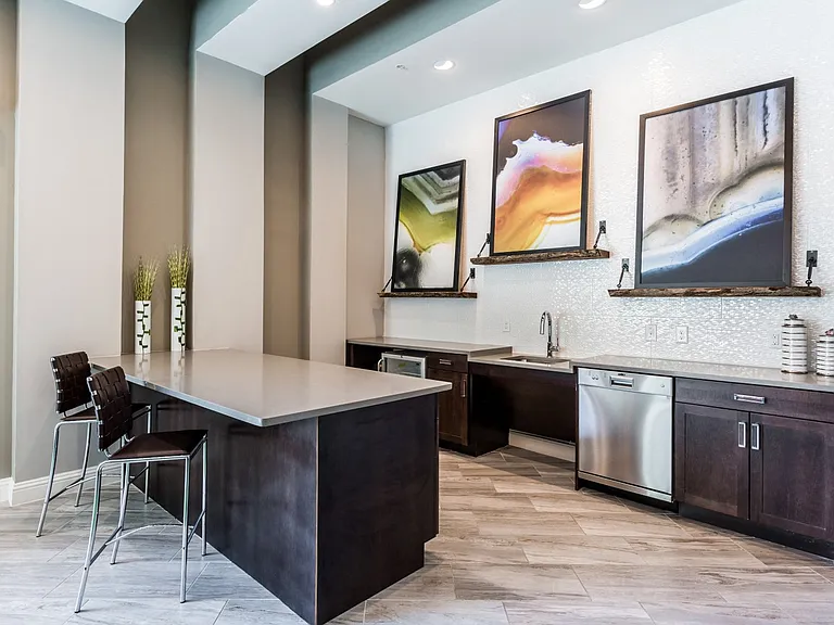Community kitchen with wood-style flooring, microwave, sink, and dishwasher