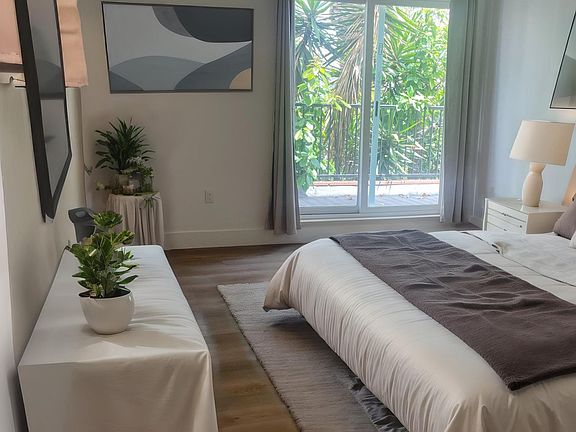 STAGED MASTER WITH SLIDING DOORS TO BALCONY
