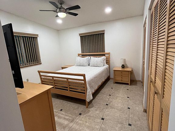 Master bedroom with two large closets, linen closet, and en-suite full bathroom