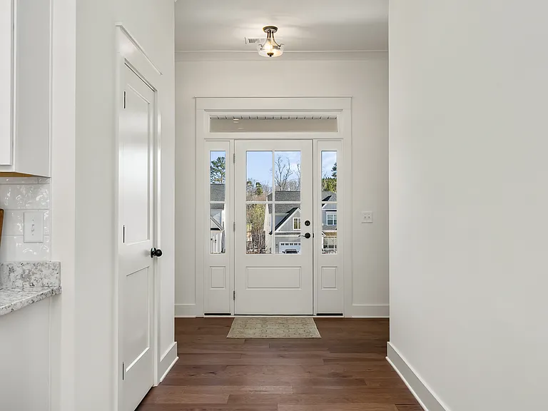 Extra wide foyer entrance with engineered hickory hardwood floors with 10' ceilings throughout.