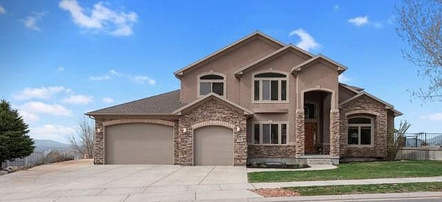 Five car garage and RV parking on side of home. Automatic sprinklers and 1.8KW solar array to keep electrical costs down.