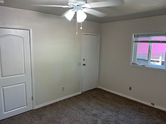 Bedroom 2 - door to the right in the corner is an exterior door to a small porch