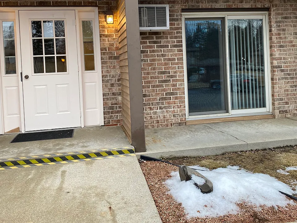 front door and patio door entrance to unit