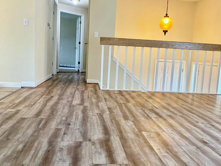 Upstairs living area and hallway with new LVP