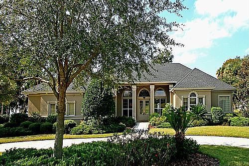 The front of this home features a circular driveway.