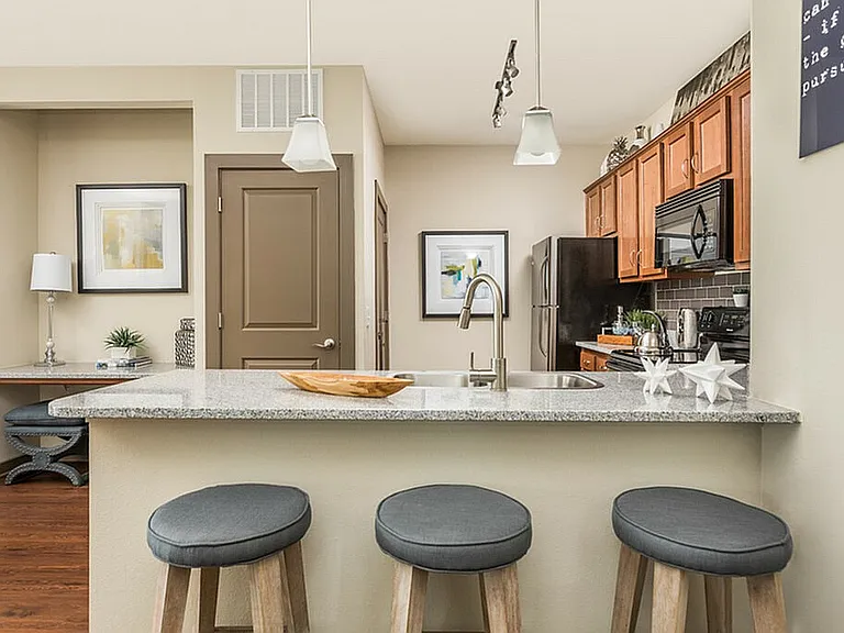 Modern kitchen meets practical design, with a built-in desk in sight for days when you're working (or online shopping) from home.