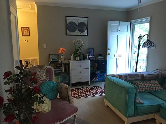 Living room with entrance door showing taken from the entran
