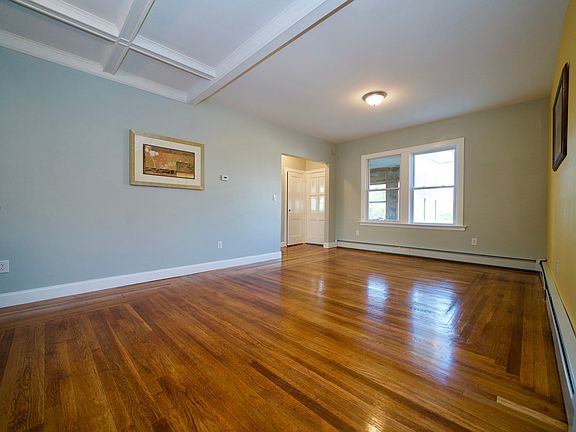 Open concept living room with an enclosed porch.