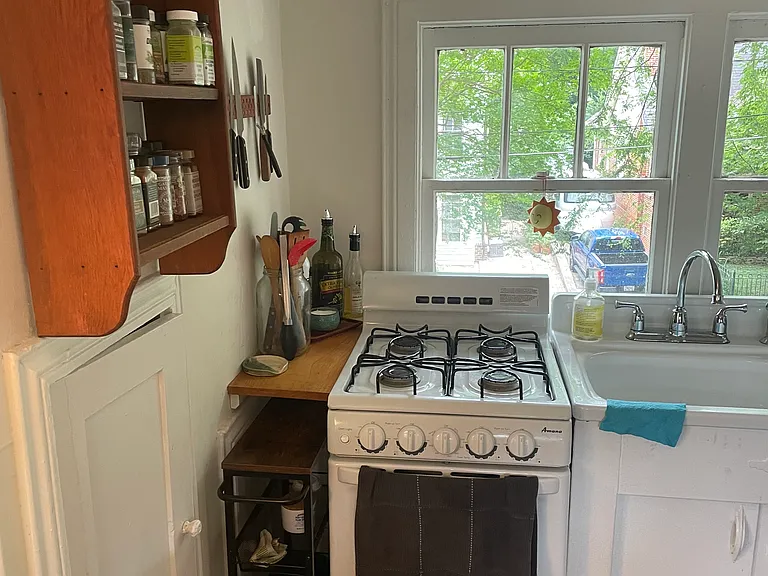 Kitchen - view of stove and sink.