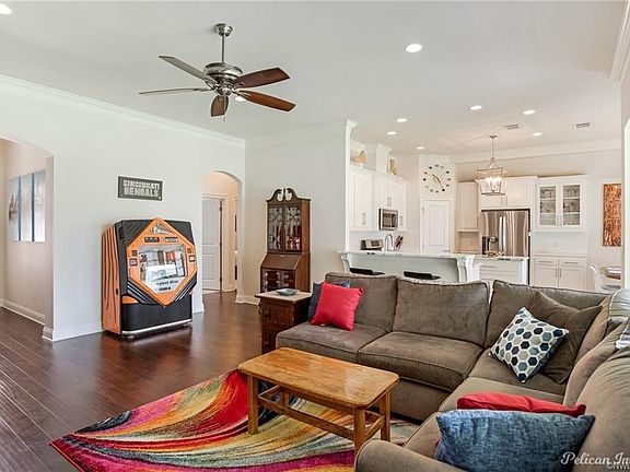 The wood floors and high ceilings accentuate the openess of this floor plan.  The 4 large windows introduce the natural light which creates the feeling of one big, open room.