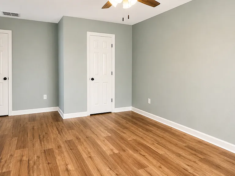 Master bedroom, entrance to walk in closet to the right & master bathroom to the left.
