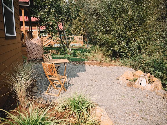 Sitting area on creek with firepit