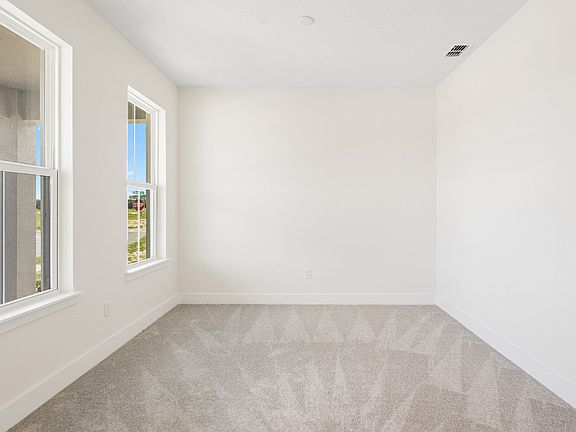 The Sweetgum front room flex space on left of entry two story home in Trailside in Mount Dora by DRB