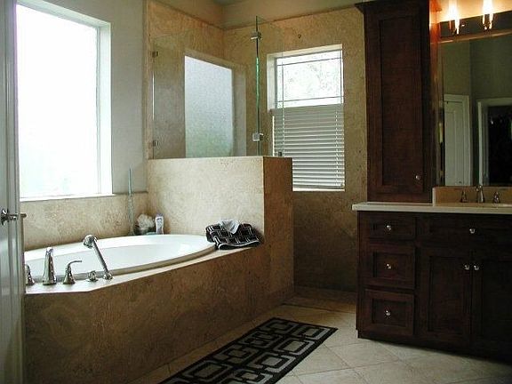 Luxurious 6ft soaking tub and walk in shower.
