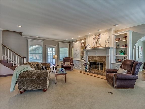 Very spacious living room with fireplace and door to enclosed back porch.