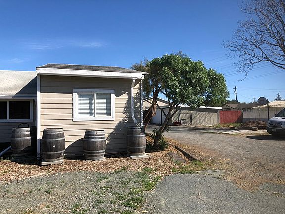 Water-conserving rain barrels in back and one parking place