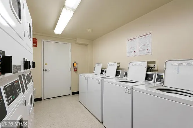 Laundry room in basement. Machines take credit cards. Rarely a wait.