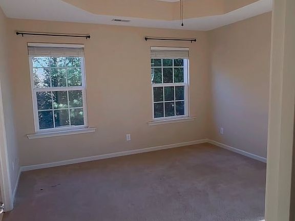 The large master bedroom features tray ceilings, a massive walk-in closet, and on-suite bathroom.