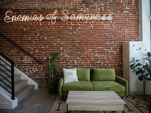 Exposed brick wall adds warmth and visual interest.