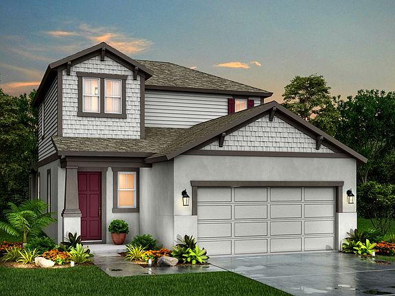 Jade Craftsman elevation B at dusk available only at BridgeWater by William Ryan Homes Tampa